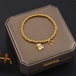 Pulsera de Esferas y Osos en Dorado.